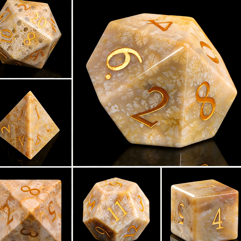Close-up of chrysanthemum stone D20 die for tabletop RPG — midnight black with white floral crystal patterns