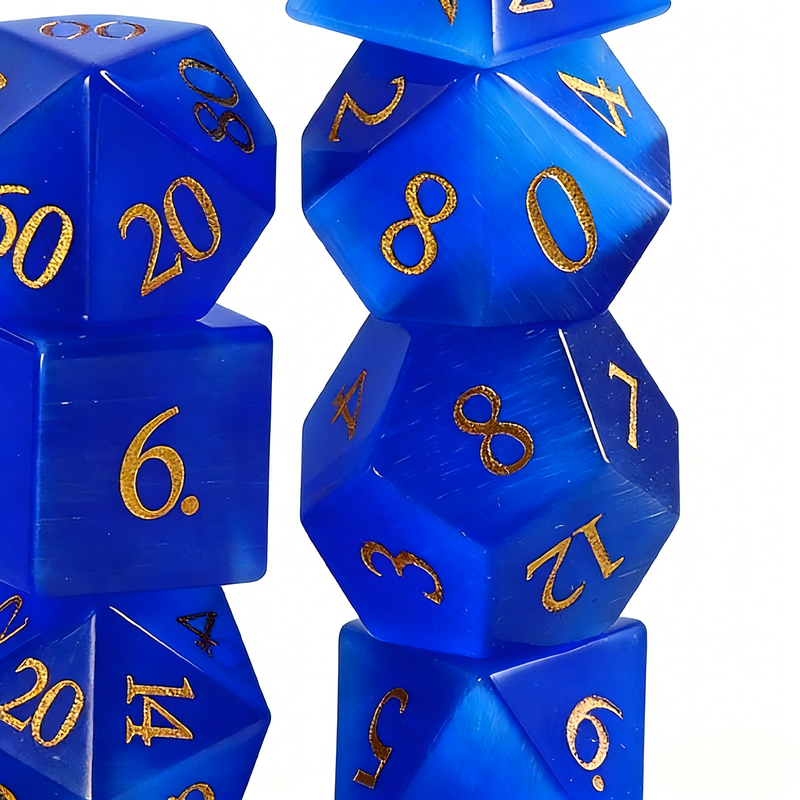 7-piece cat's eye stone DND dice set — deep cerulean blue with white light band with chatoyant shimmer