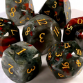 Close-up of African bloodstone D20 die for tabletop RPG — deep green with vivid red jasper inclusions