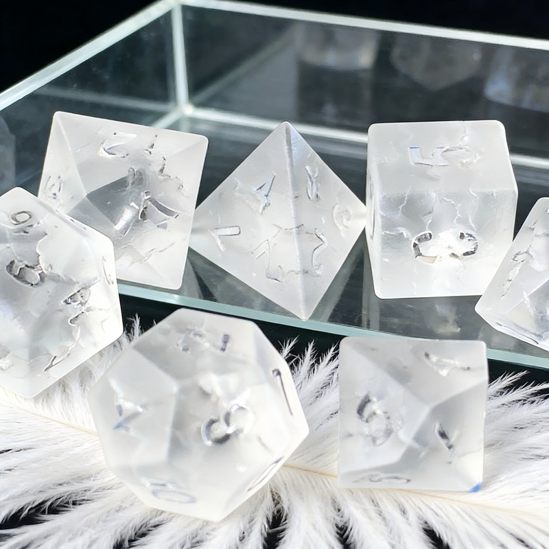 transparent frosted with gold crackle veining crystal dice close-up — engraved numerals for DND