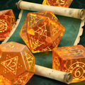 Close-up of translucent amber-orange glowing glass crystal D20 for Dungeons and Dragons