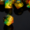 Close-up of rainbow cat's eye stone D20 showing light band effect — tabletop RPG dice
