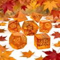 7-piece translucent amber-orange glowing glass crystal DND dice set for tabletop RPG