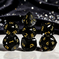 Close-up of clear charcoal grey with smoke-and-glass effect crystal D20 for Dungeons and Dragons