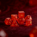 7-piece cat's eye stone DND dice set — deep crimson with sharp white light streak with chatoyant shimmer