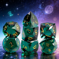 7-piece K9 crystal DND dice set — rich olive green with sharp diamond facets