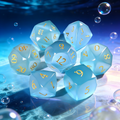 7-piece cat's eye stone DND dice set — cool silver-grey with diamond-cut facets with chatoyant shimmer